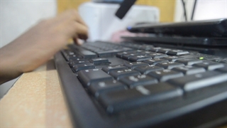 Person Using A Keyboard